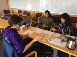 Rob Thompson, Will Chen, and Rachel Lee of EarthGamesUW working on their game AdaptNation at the Climate Game Jam.