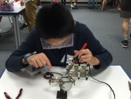 Alexander Riley works on the ROV during summer camp.