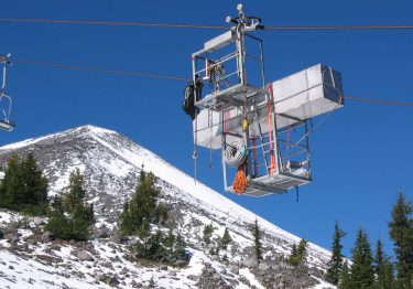 Researchers use the ski lifts to carry equipment to sample air on the summit. A radon sensor travels to the peak of Mount Bachelor.
