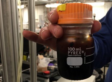 A container of bio oil, produced by the UW research team.
