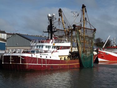 A vessel known as a beam trawler sits at the dock in Milford Haven, Wales, United Kingdom.
