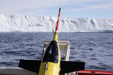 A Seaglider, with the Getz Ice Shelf in the background, being prepared for deployment in January 2018 under the neighboring Dotson Ice Shelf.