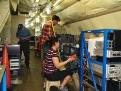 Co-author Felipe Lopez-Hilfiker (center), then a UW doctoral student in atmospheric sciences, adjusts instruments in 2013 inside the NOAA P-3 aircraft.