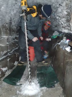 Zac Cooper and Shelly Carpenter begin to drill below the Alaskan ice tunnel toward the cryopeg and its salty subzero water. Researchers are careful to sterilize their equipment to avoid introducing contamination from above ground. The most stringent of such techniques will be needed to sample for life on other planets. Go Iwahana/University of Alaska, Fairbanks