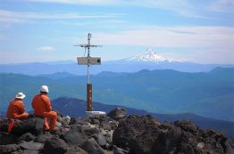 Field engineers Karl Hagel and Pat McChesney with Mount Hood in the distance.