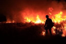A firefighter in Idaho works after dark