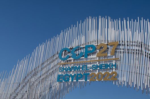 sign welcoming participants to COP27