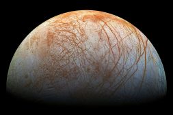 Red streaks across the surface of Europa, the smallest of Jupiter’s four large moons.